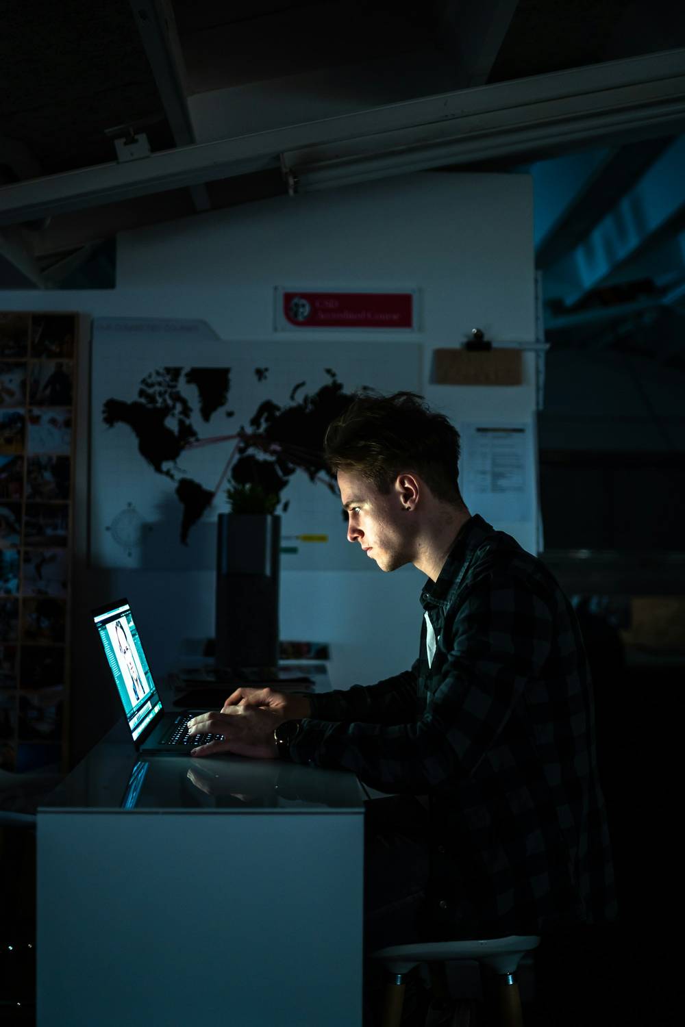 Campaign strategist working on a laptop